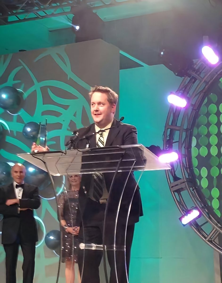 President Brett Robinson Receiving the 2014 International Retailer of the Year award for Norburn Lighting and Bath