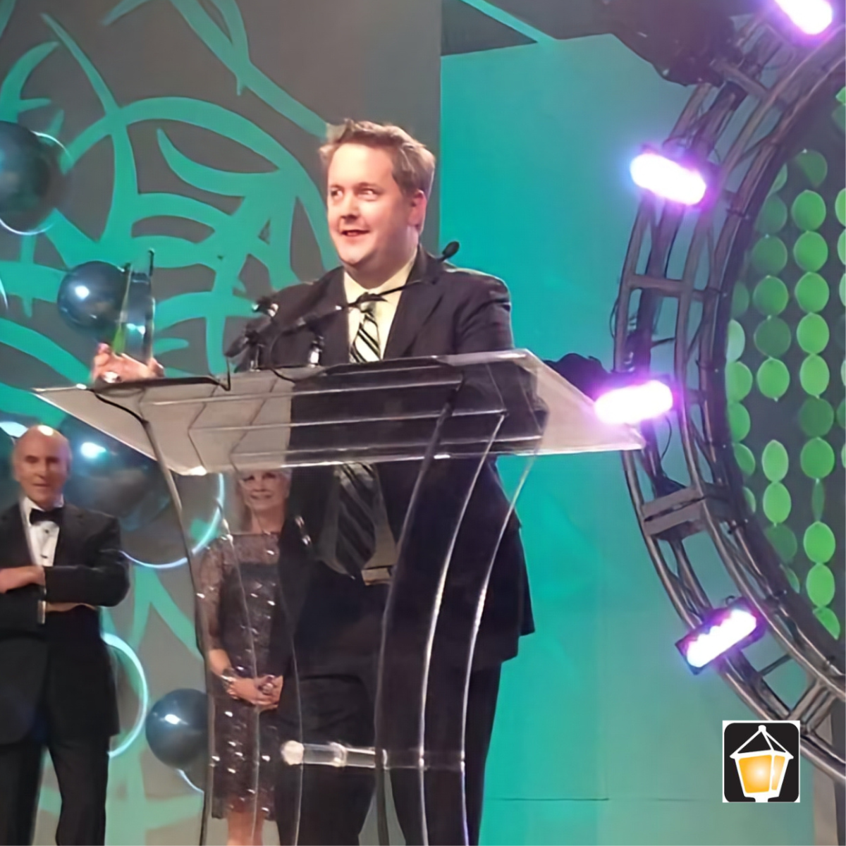President Brett Robinson Receiving the 2014 International Retailer of the Year award for Norburn Lighting and Bath