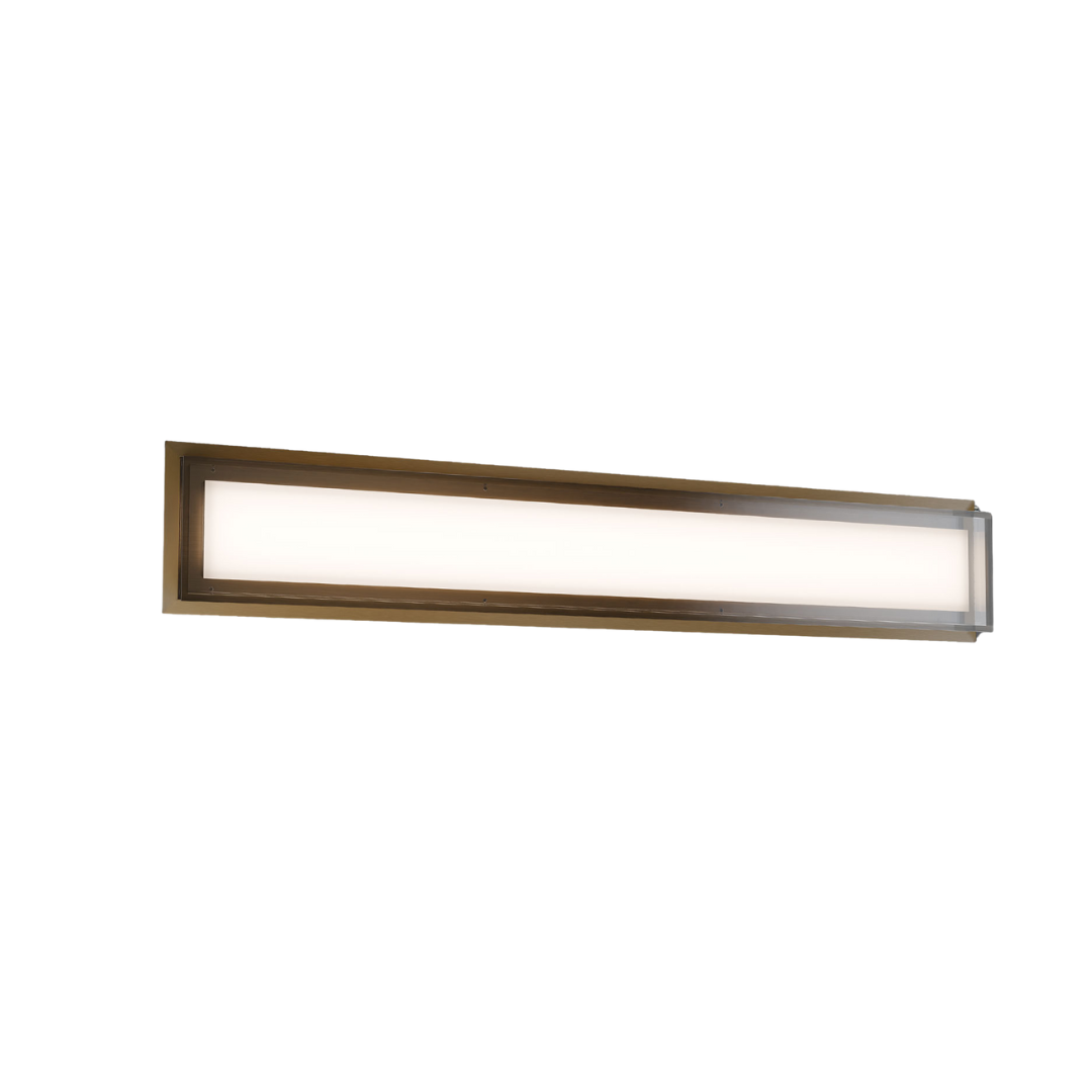 Contemporary linear LED wall sconce with a frosted diffuser and warm brass frame—ideal for modern bathrooms, vanities, or hallway lighting. Shop Norburn Lighting