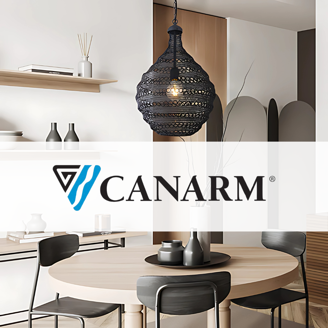 Canarm black woven pendant light hanging over a modern round dining table with minimalist decor, matte black chairs, and neutral tones in a contemporary interior.