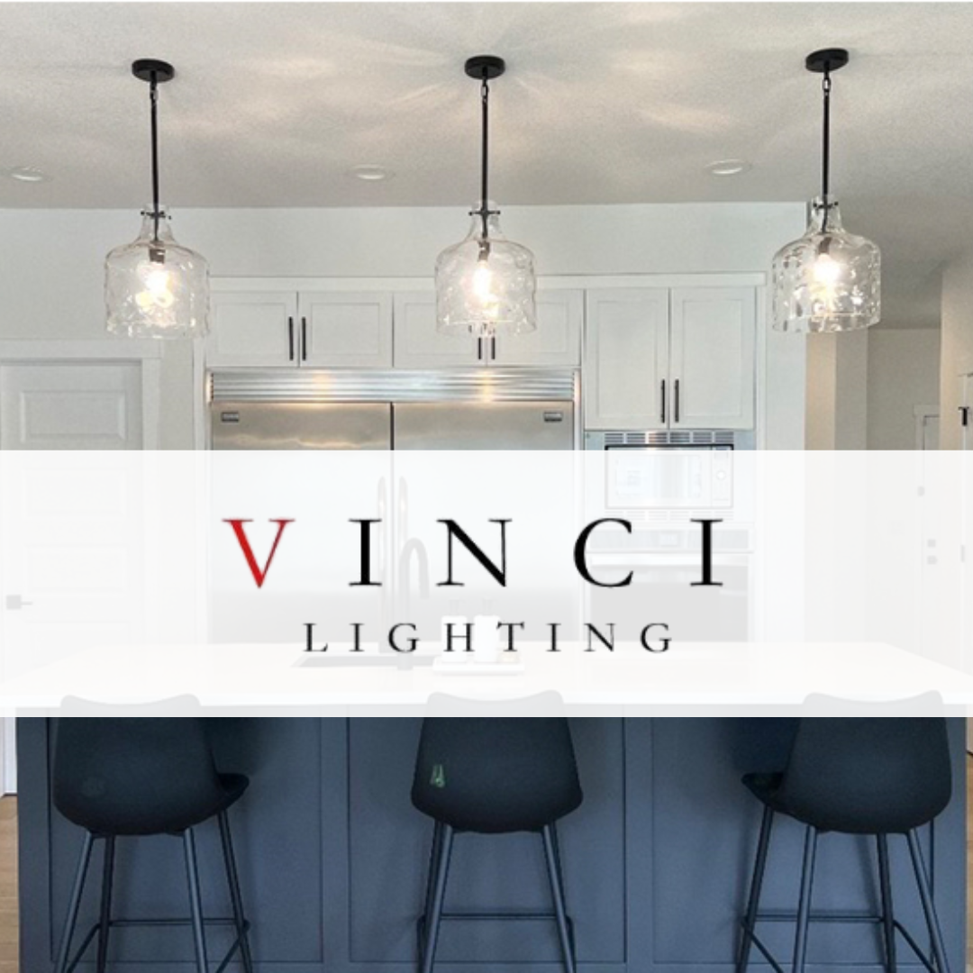 Vinci Lighting clear glass pendant lights with black suspension mounted over a modern kitchen island featuring navy blue cabinetry and black bar stools.