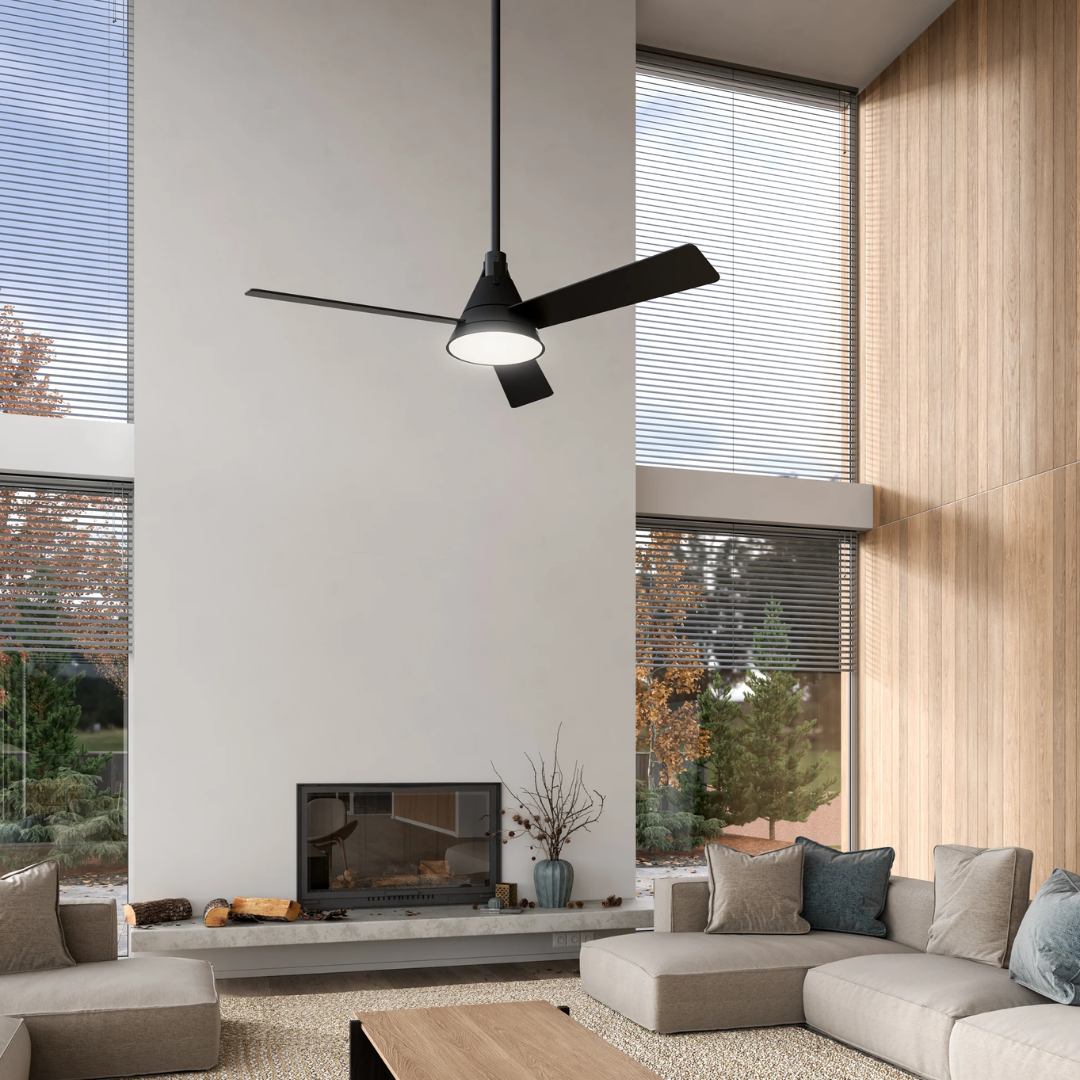 Modern black ceiling fan with integrated LED light by Alora Lighting, installed in a high-ceiling living room with floor-to-ceiling windows and minimalist décor