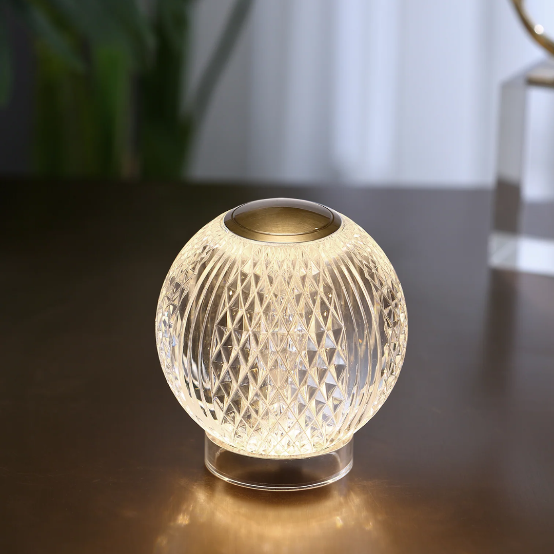 Crystal glass portable lamp by Alora Lighting featuring a diamond-cut globe design and warm LED glow—ideal for accent tables, shelves, or bedside lighting